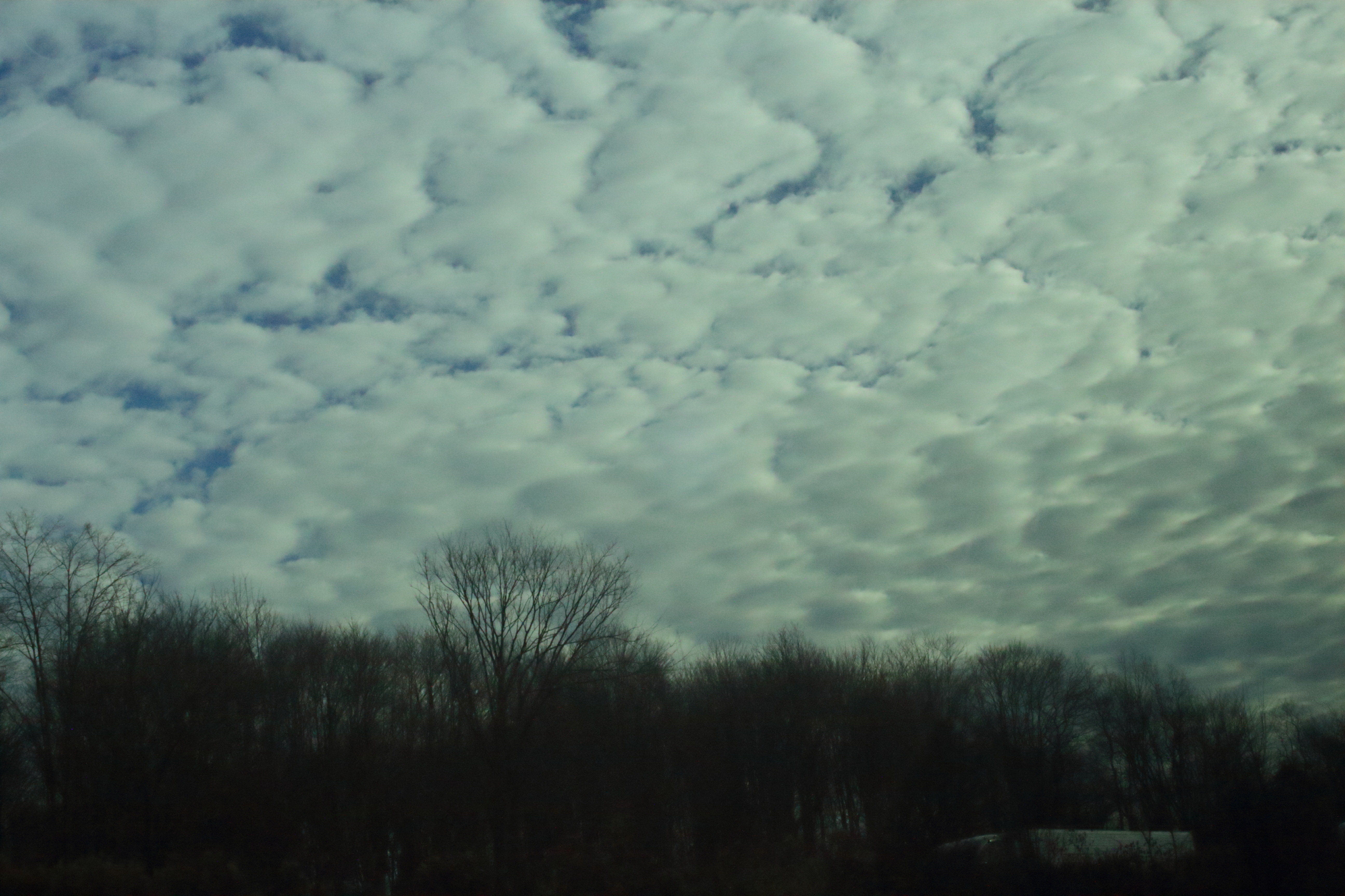 A picture of cloud cover ranging from dark and moody to some blue here and there